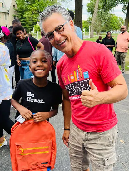 Mike Morse with a student at Project Backpack