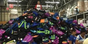 Pile of backpacks ready to be sent to schools