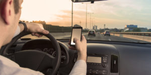 Driving and using your phone at the same time could cause a car accident