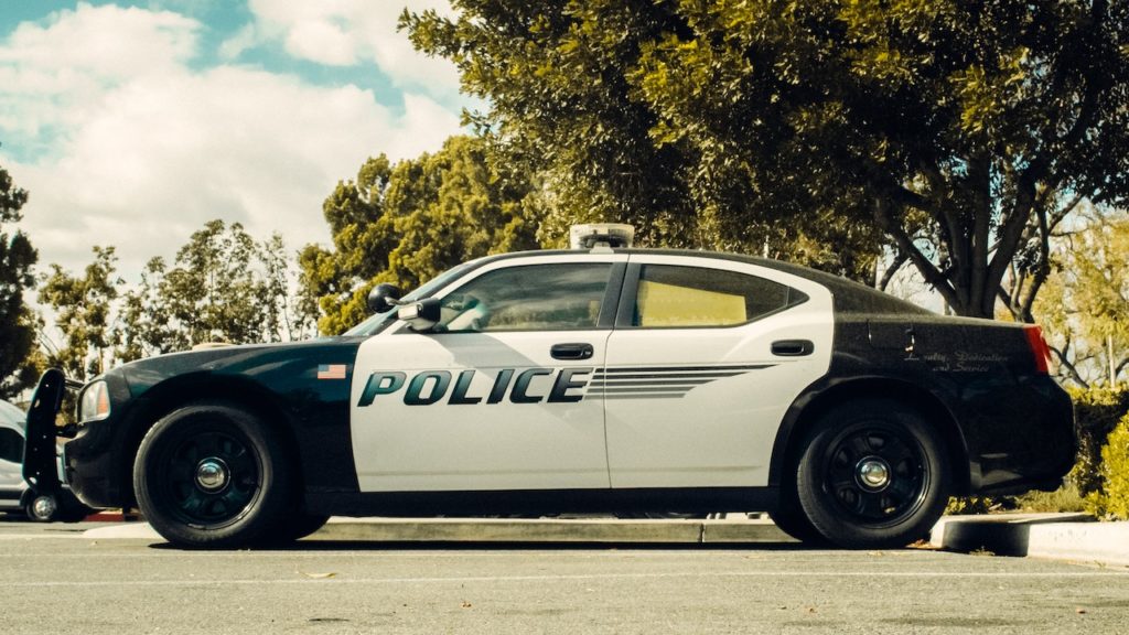 what happens when a police car damages my car