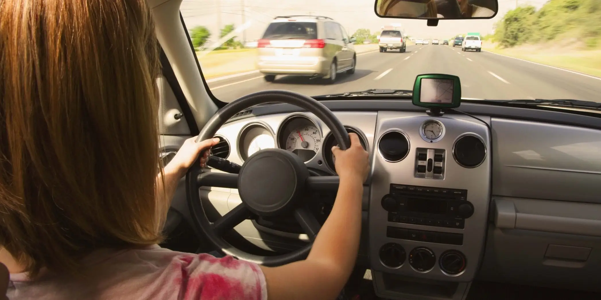 Person driving a car feeling secure that they have a good insurance coverage
